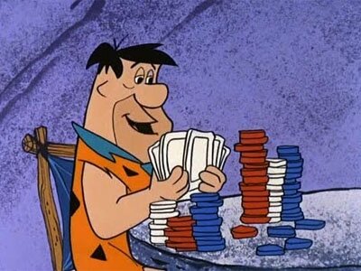 Fred Flintstone Holding Cards