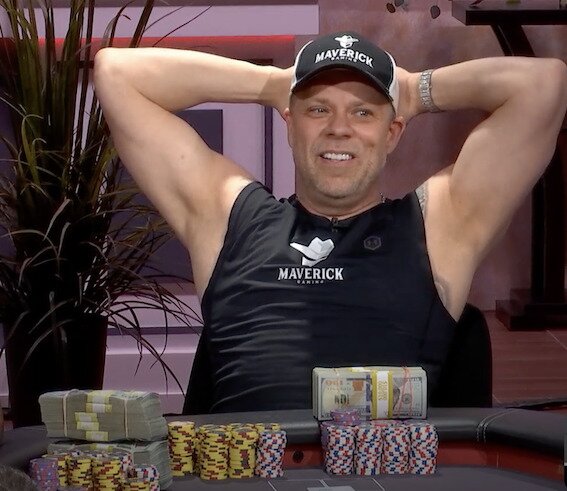 Eric Persson with his hands behind his head