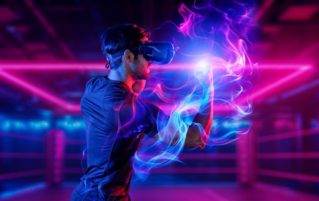 Man punching air wearing VR headset