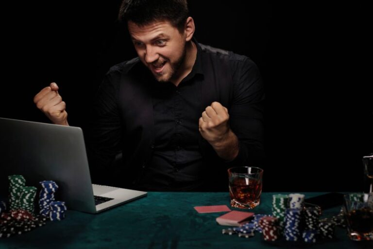 A man celebrating as he reads his response from ChatGPT